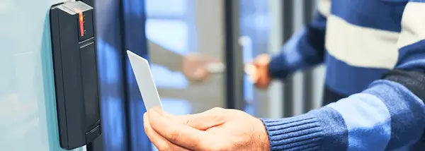 Man using card to open door using access control system