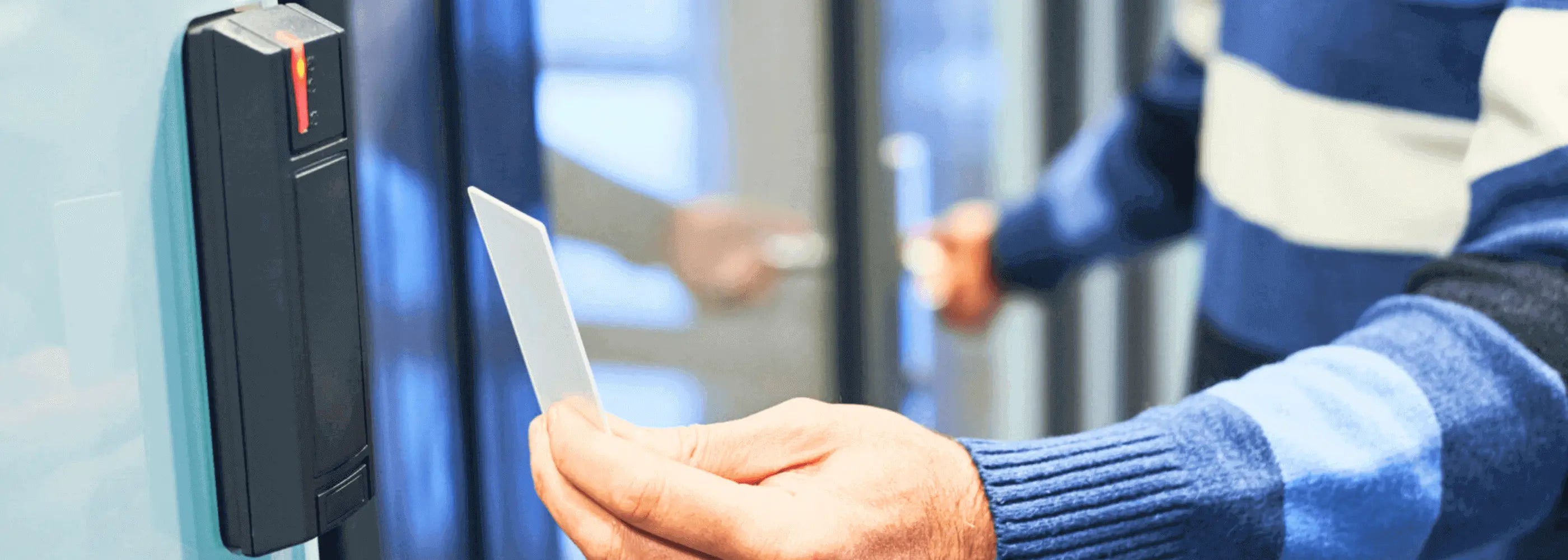 Man using card to open door using access control system