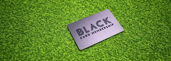Black custom printed membership card on artificial grass