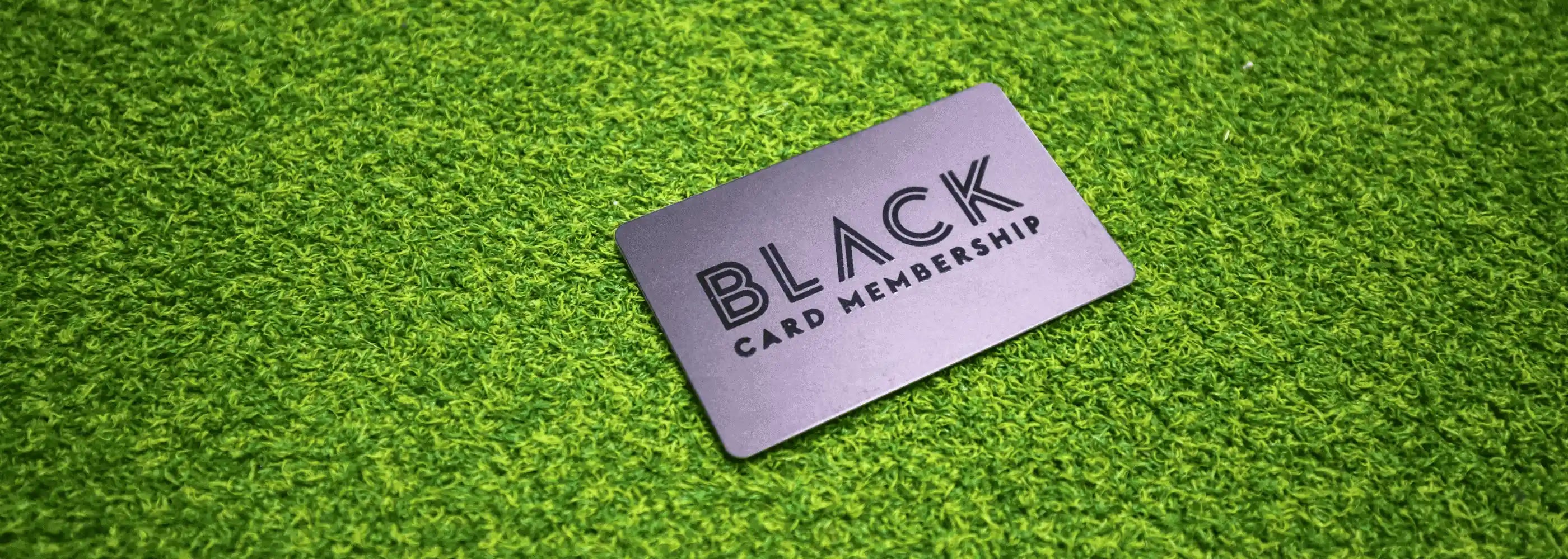 Black Custom Printed Membership Card on green artificial grass