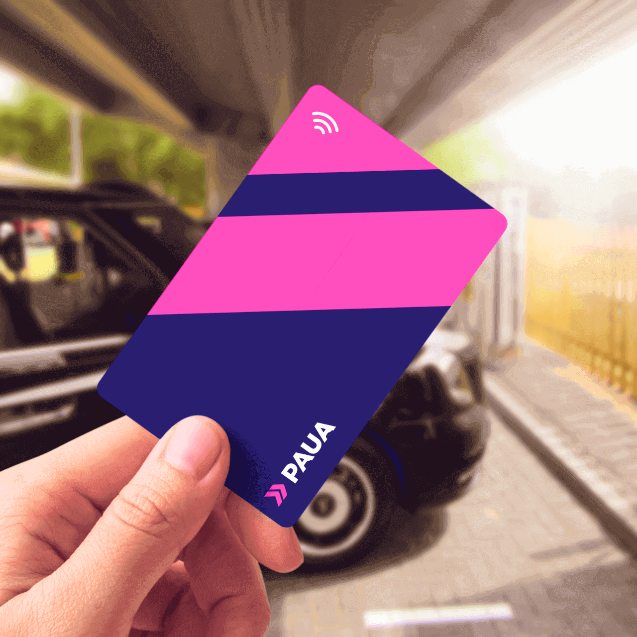 Paua EV Charging Card held up in front of car