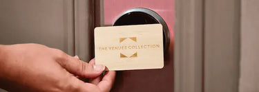 The Venues Collection Custom Printed Wooden RFID Hotel Key Card being used to open a hotel room door