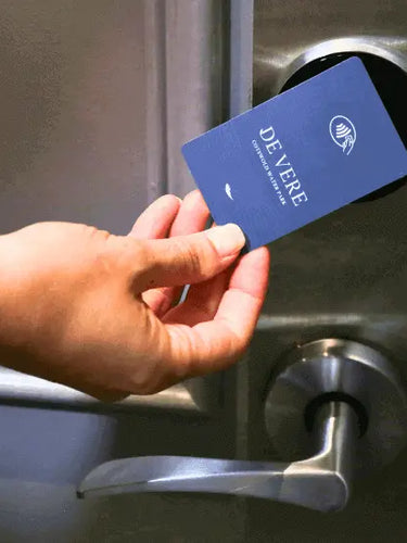 Custom Print Hotel Key Card being held against a hotel door