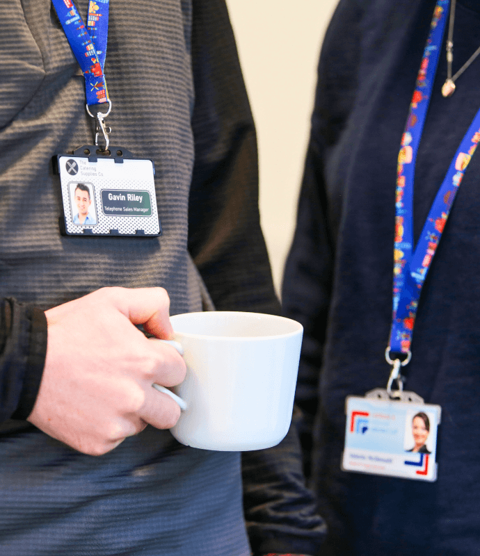 ID Cards in ID Holders being worn by two people at an event