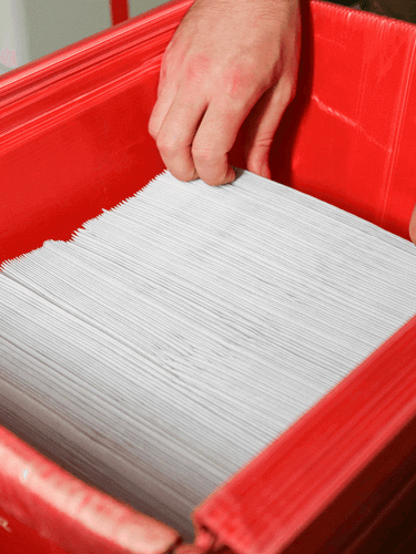 Printed Letters in a red mailing box