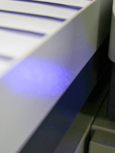 Printer machine light with printed letters nearby