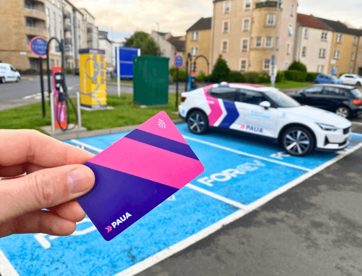 Paua EV Charging Card pictured near a vehicle